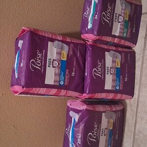 4 Packs Of  POISE PADS
